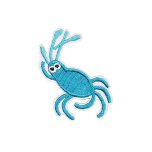 Toppa ricamata a forma di creatura marina blu cartoon con bordo bianco per vestiti