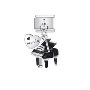 Macro view of a silver piano and heart music charm for an Italian modular bracelet link