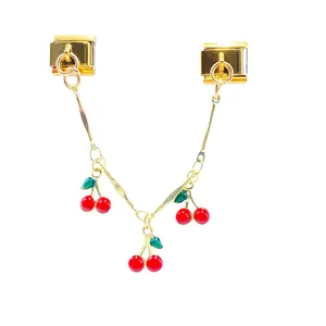 Detail view of Italian charm link with three dangling red cherry pendants for DIY jewelry
