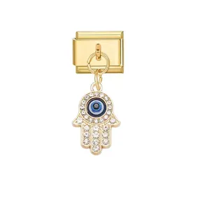 Detailed view of gold Italian link charm with rhinestone Hamsa hand and evil eye.