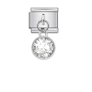 Detailed macro view of a silver Italian modular bracelet link with a clear crystal charm