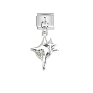 Close-up detail of silver stainless steel modular charm with heart-shaped crystal and stars