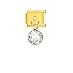 Close-up of a gold Italian charm link with a dangling round clear crystal stone