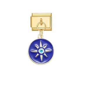 Detailed macro shot of a gold Italian modular charm with a blue Evil Eye star pendant