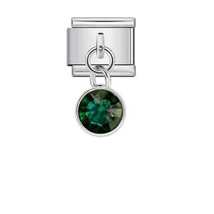 Detailed view of Italian charm link with faceted green birthstone pendant