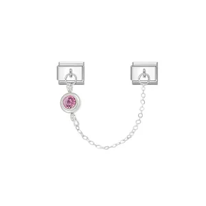 Close-up of stainless steel Italian charm featuring a pink birthstone and security chain.