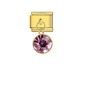 Detail view of gold Italian charm link with a faceted purple round crystal pendant