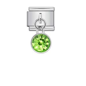 Close-up of silver Italian charm module with peridot green round gemstone pendant