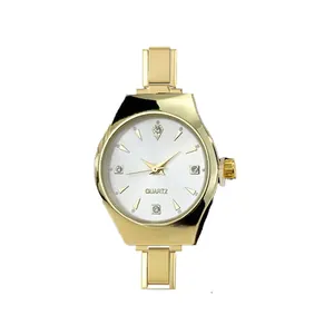 Detail of gold Italian modular quartz watch with diamond markers and white dial
