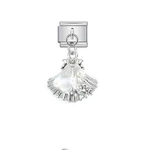 Detailed view of a silver shell charm with pearl and crystals for Italian bracelets