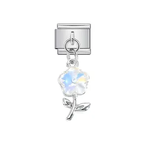 Detail showing a shimmering iridescent flower pendant on a stainless steel Italian charm link
