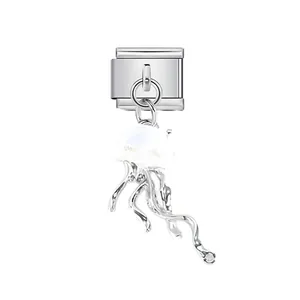 Close-up detail of a stainless steel Italian charm link featuring a translucent jellyfish dangle