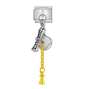 Close-up of graduation theme Italian charm link with diploma and gold tassel detail
