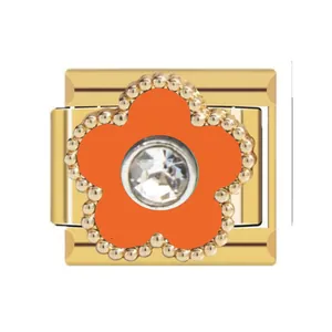 Close-up of gold Italian charm module featuring an orange flower with a central crystal.