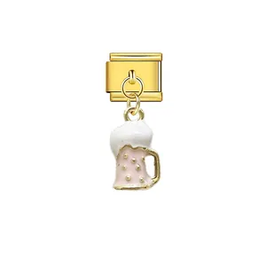 Close-up of a gold-toned Italian link charm with a dangling pink beer mug pendant