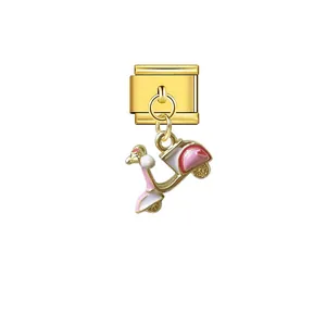 Detailed view of gold Italian modular charm with pink and white cartoon scooter pendant