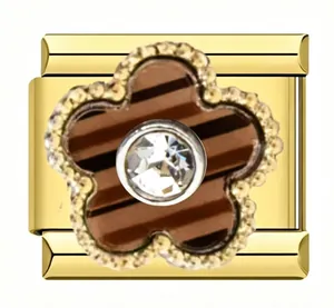 Close-up of gold flower Italian modular charm with a sparkling central crystal detail.