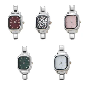 Five stylish square modular watch heads featuring various dial colors and leopard patterns
