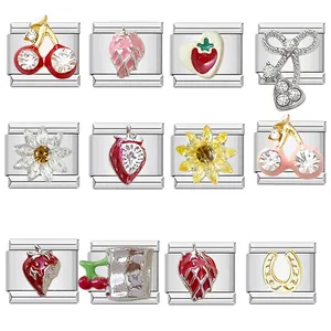 Detailed view of assorted stainless steel Italian charm links with fruit and flower motifs