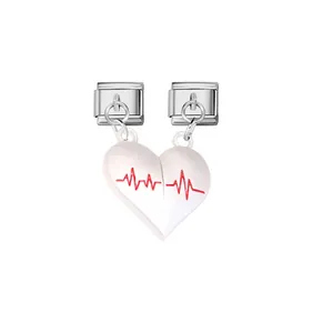 Detail view of magnetic split heart charms with red EKG line for Italian modular bracelets.