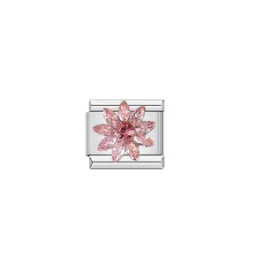 Close-up of modular stainless steel charm featuring a sparkling pink crystal flower design