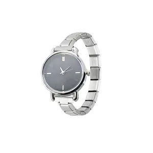 Detail of silver modular stainless steel watch strap and textured black dial