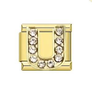 Detail view of gold stainless steel Italian charm featuring rhinestone letter U