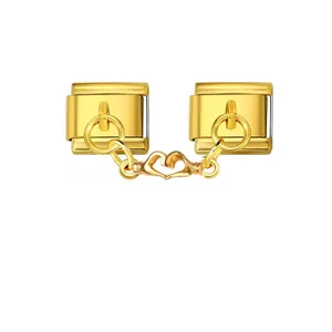 Close-up of golden Italian modular charm links with heart-hand connector