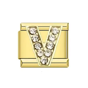 Macro view of gold stainless steel Italian charm with rhinestone letter V detail