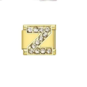 Detailed macro view of a gold-plated Italian charm link featuring a rhinestone letter Z