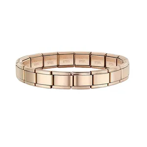 Detailed view of rose gold modular Italian charm bracelet links in stainless steel