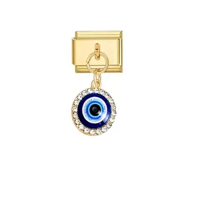 Close-up of gold Italian charm link featuring a crystal-bordered blue evil eye pendant