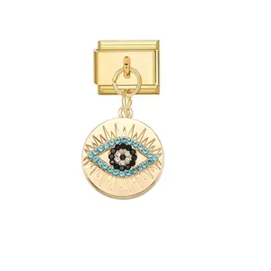 Detailed view of gold Italian charm link with shimmering blue rhinestone evil eye pendant