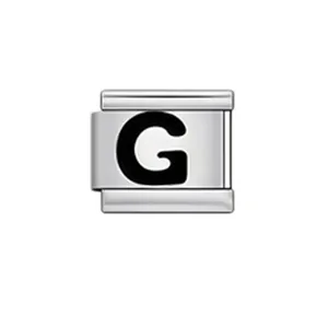 Detailed view of a silver Italian charm link featuring a black serif letter G for DIY jewelry