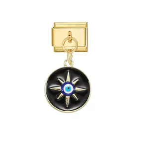 Close-up detail of Italian charm link with golden starburst and blue evil eye enamel pendant