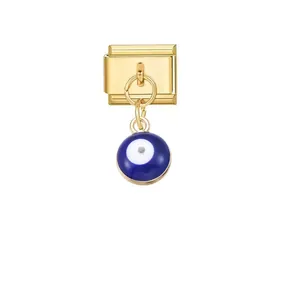 Detailed view of a golden Italian charm link featuring a vibrant blue evil eye pendant charm