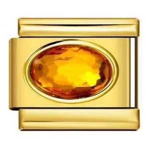 Close-up of golden stainless steel modular charm with oval yellow birthstone