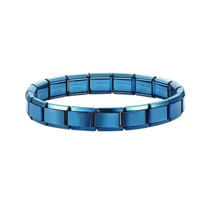 Detail view of a blue stainless steel Italian modular charm bracelet with metallic finish