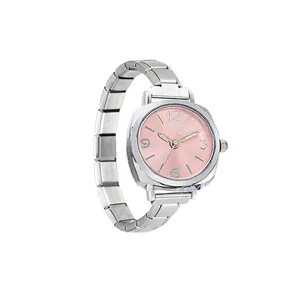 Detail shot of a women's minimalist quartz watch featuring a pink dial and silver modular band