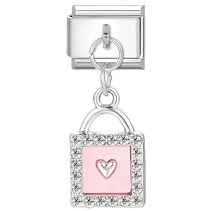 Detail shot of a silver Italian charm link with a pink rhinestone heart lock pendant.