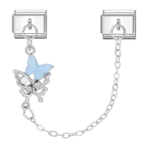 Detail of silver Italian charm link with blue butterfly pendant and connecting chain