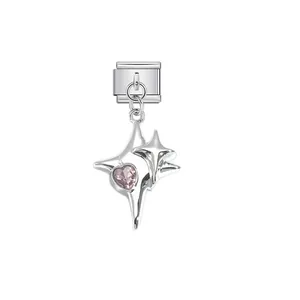 Close-up detail of a silver stainless steel star charm with a sparkling pink heart crystal.