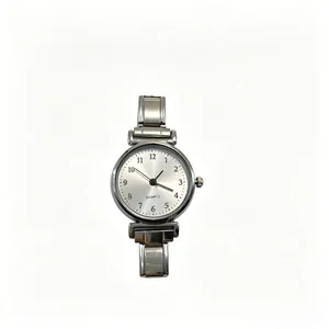 Detailed view of silver minimalist quartz watch with white dial and metal link band