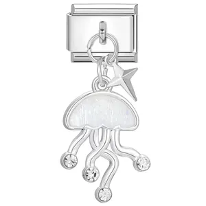 Detailed macro view of a silver jellyfish Italian modular charm featuring a star and crystals.