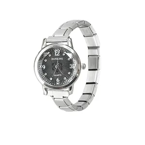 Detailed view of women's quartz watch with radial black dial and modular silver steel band