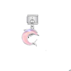 Close-up of pink iridescent dolphin charm for stainless steel modular jewelry accessory.