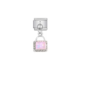 Macro view of pink rectangular crystal pendant with rhinestone border on steel link