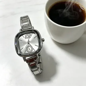 Elegant silver stainless steel quartz watch with rhinestones on a marble surface