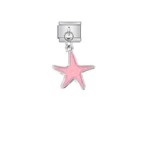 Macro detail of a pink enamel starfish charm attached to a stainless steel modular link