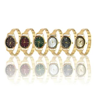 Collection of six elegant quartz watches with oval dials and gold metal chain bracelets.